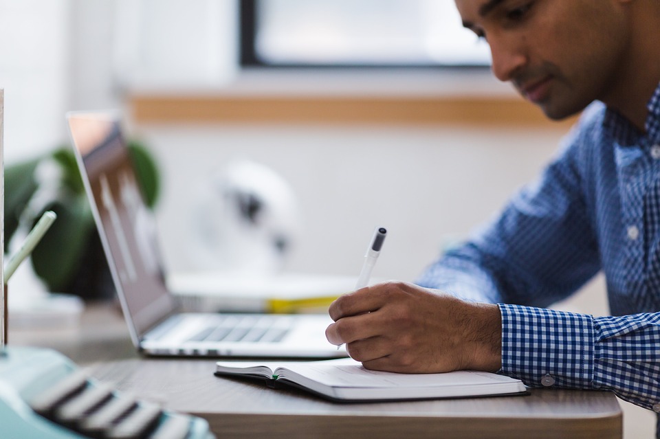 Man researching on laptop