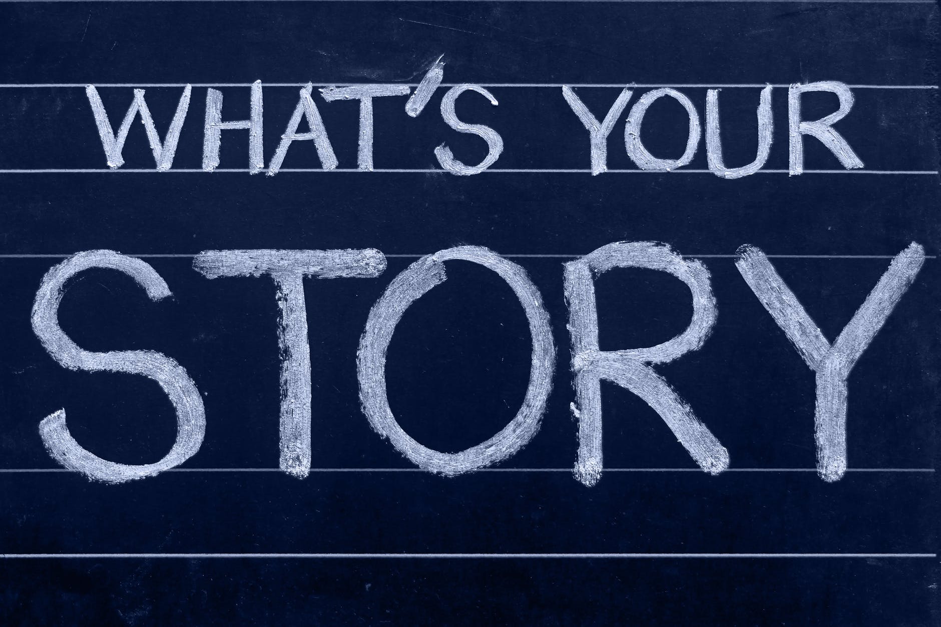 Chalkboard with 'What's Your Story?'