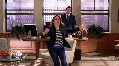 In a clip from 30 Rock, an elated Liz Lemon (Tina Fey) runs out of Jack's (Alec Baldwin) office, pumping her arms in the air.